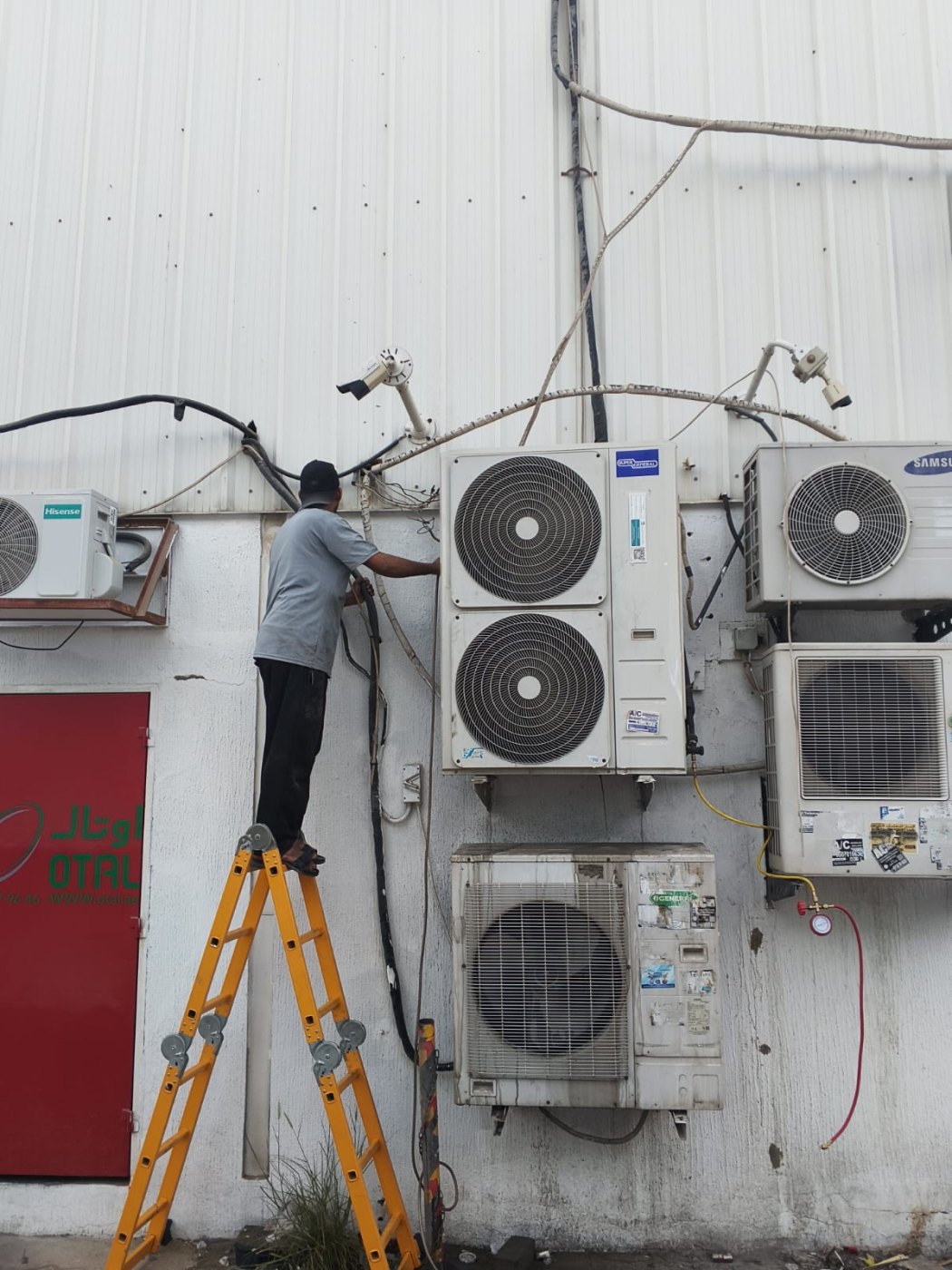 Repairing outdoor AC condenser wiring in Dubai
