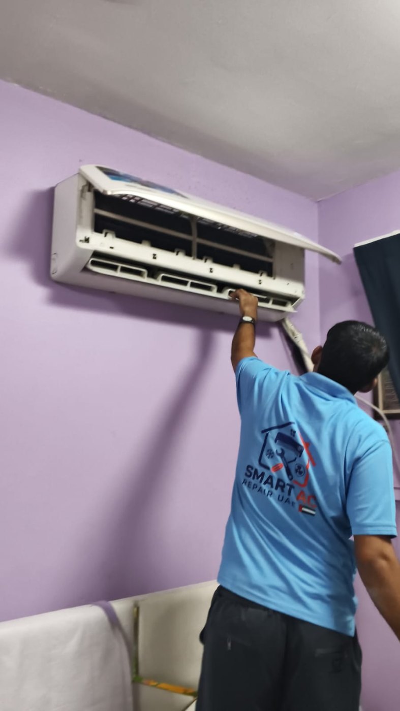 Smart AC Repair technician servicing a split AC in Dubai