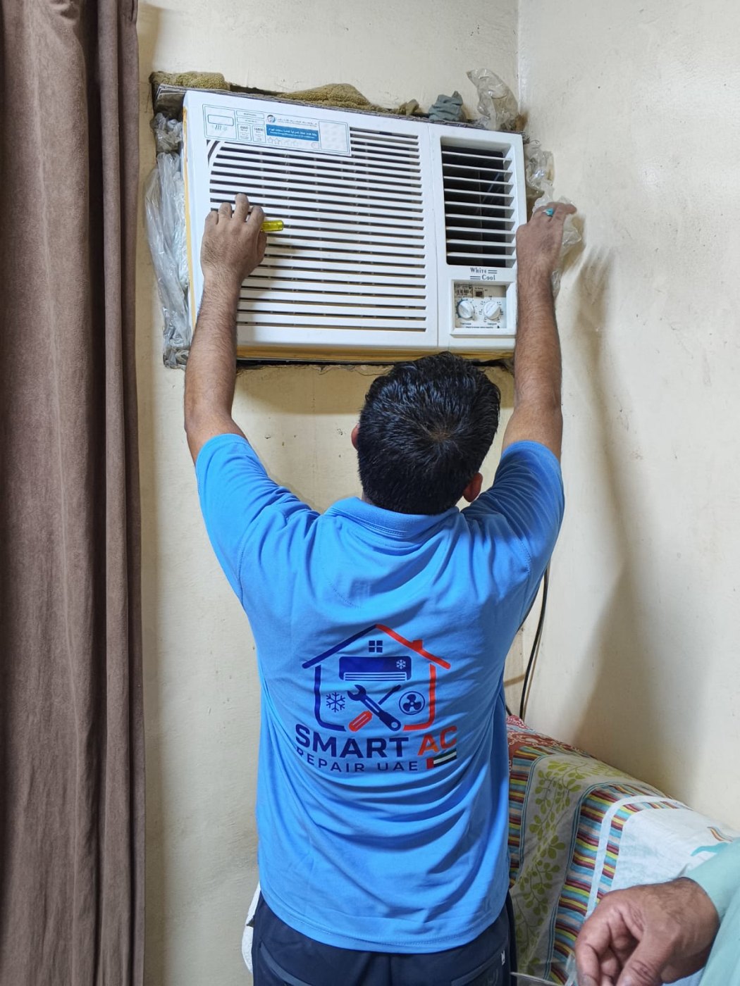 Repairing a window AC unit in Dubai